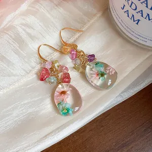 Handmade ethnic style resin earrings with dried flowers and colorful natural stones detail