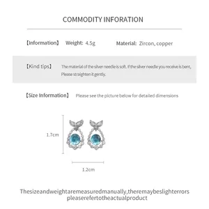 Detailed view of zircon fishtail stud earrings showing 1.7cm height and 1.2cm width