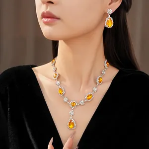 Elegant jewelry set with yellow teardrop stones and rhinestones