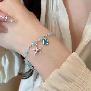 Korean style summer bead bracelet with silver starfish and blue gemstone charm