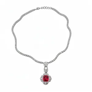 Elegant silver necklace with a large square red zircon pendant and sparkling stones.