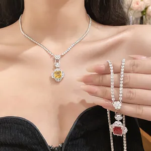 Close-up of silver-plated necklace and bracelet set with square zircon stones