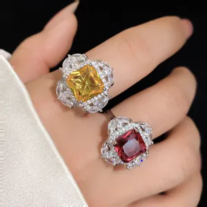 Close-up detail of luxury square zircon open rings featuring yellow and red gemstones