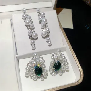 Elegant resin pearl drop earrings and green gemstone stud earrings set