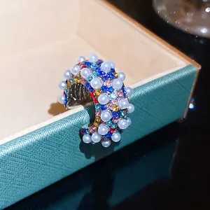 Vintage C-shaped ear cuff featuring colorful rhinestones and elegant faux pearls