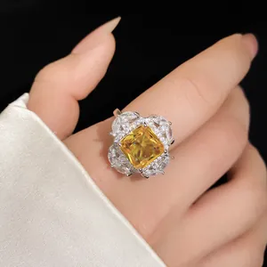 Detailed view of the luxurious yellow square zircon ring with marquise stone halo.