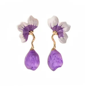 Floral drop earrings with purple and white gradient petals and golden stems.
