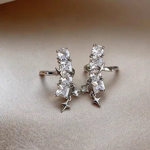 Detailed view of elegant star zircon ear clips for non-pierced ears in silver finish