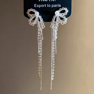 Elegant zircon pearl bow tassel earrings with a shimmering silver-tone finish
