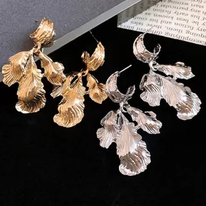 Vintage metallic leaf drop earrings in gold and silver finish with textured details