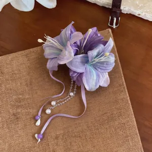 Elegant lavender purple fabric flower hair clip featuring imitation pearl tassels and silk ribbons