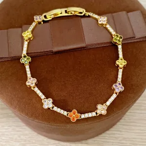 Elegant 14k gold-plated clover flower bracelet with multi-colored cubic zirconia stones