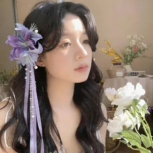 Elegant purple fabric flower hair clip with pearl tassels and ribbons for women
