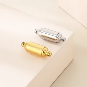 Detailed view of gold and silver cylindrical magnetic jewelry clasps
