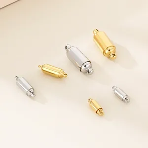 Detailed view of cylindrical stainless steel magnetic jewelry clasps in gold and silver finishes.
