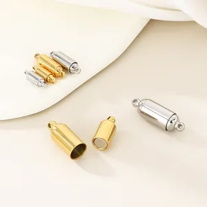 Detailed view of cylindrical magnetic jewelry clasps in gold and silver stainless steel