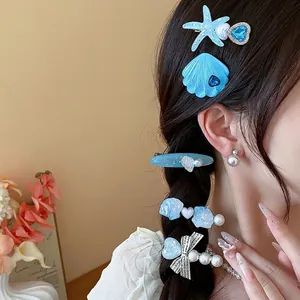 Elegant ocean-themed resin starfish and seashell hair clip set with faux pearls for women