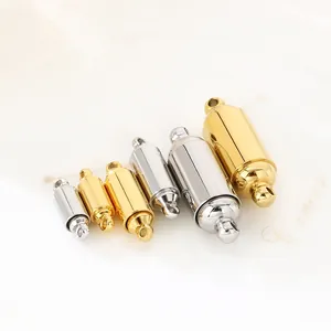 Detailed view of cylindrical magnetic jewelry clasps in various gold and silver sizes