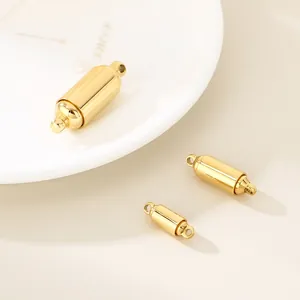 Macro view of gold cylindrical magnetic jewelry clasps in three sizes for DIY chains