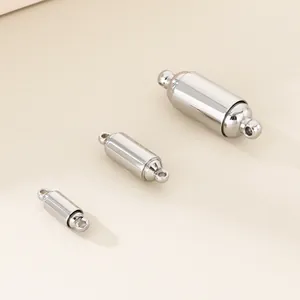 Detailed view of three sizes of polished stainless steel cylindrical magnetic clasps