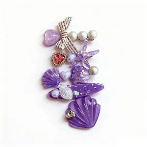 Exquisite purple resin hair clip set featuring starfish shell and pearl charms design