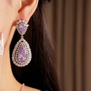 Elegant purple zircon teardrop earrings with intricate crystal halo setting