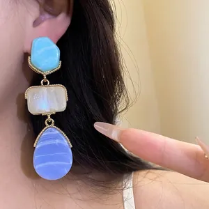 Vintage resin drop earrings with blue, cream, and lavender tiered pendants