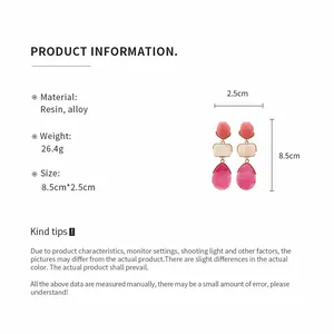 Detail view of resin teardrop earrings with dimensions 8.5cm by 2.5cm and material info
