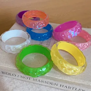 Colorful resin bangles with irregular bumpy texture for a trendy island style look