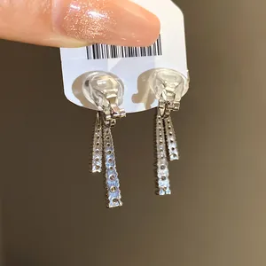Detailed view of silver-toned zircon drop ear clips showing comfortable back pads