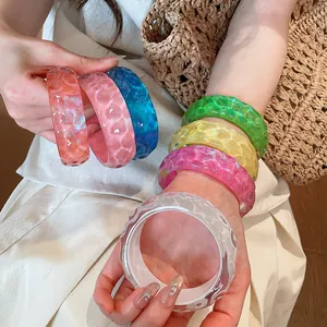 Set of colorful irregular resin bangles for bohemian resort style summer jewelry.