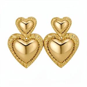 Vintage chunky gold double heart drop earrings with textured sunburst borders for women