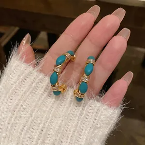 Vintage 18k gold plated C-shaped hoop earrings featuring turquoise beads and sparkling zircons
