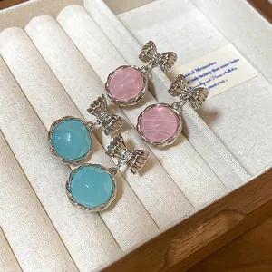 Korean style dreamy round stone dangle earrings with elegant silver bow design for women