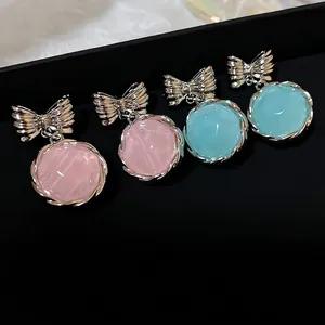 Korean style sweet bow-knot drop earrings featuring round pink and light blue stones