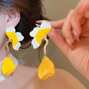 French style enamel flower petal tassel stud earrings with yellow and white accents.