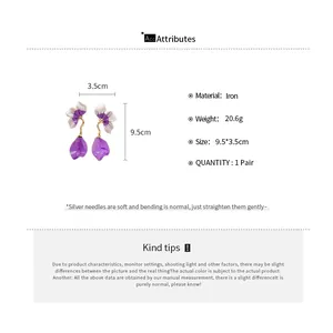 Macro view of purple oil-drop petal tassel earrings with measurement specs and material details