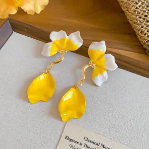 Detail showing the intricate yellow enamel finish on French style flower petal drop earrings