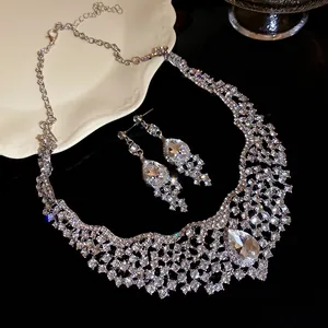 Close-up of elegant rhinestone necklace and teardrop earrings set with sparkling crystals