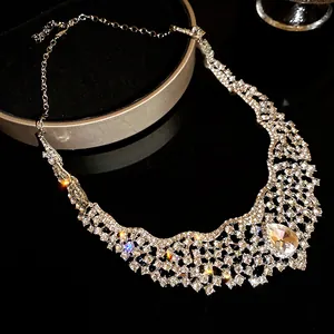 Close-up detail of luxury rhinestone mesh necklace with elegant teardrop pendant