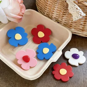 Vibrant set of minimalist geometric flower hair clips in various colors for women