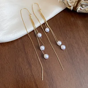 Elegant 18k gold plated long tassel ear threader earrings with delicate white pearls