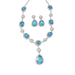 Elegant silver-tone necklace and earring jewelry set with blue teardrop rhinestones