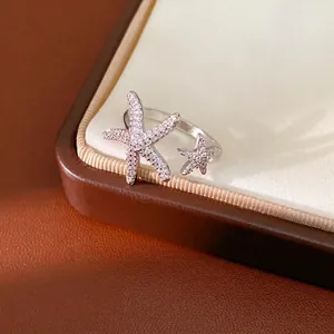 Elegant silver-toned starfish open ring featuring sparkling cubic zirconia stones