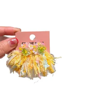 Handmade spring floral tassel earrings with pink and yellow thread details for women