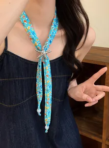 Detailed view of ocean-themed scarf necklace with silver starfish pendant and beads.