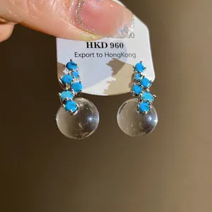 Elegant silver needle earrings with blue zircons and clear round resin drop pendants