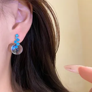 Minimalist silver needle earrings with blue zircon and clear resin round pendant