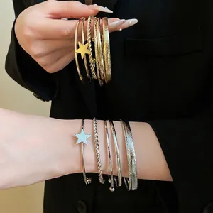 Elegant retro gold and silver star open bangle bracelet set with irregular textured finish