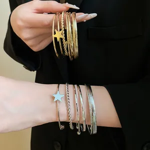 Retro gold and silver open star bangles with textured and polished finishes for a chic look